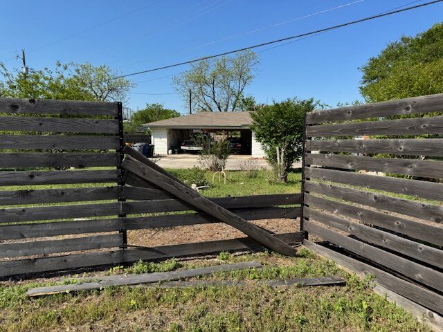 Fence storm damage — before